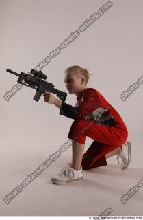 DENISA KNEELING POSE WITH GUN